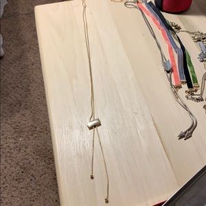 Long gold necklace necktie